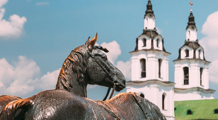 Minsk, Belarus - July 1, 2021: The crew , The Governors wheelchair and The Crew of Governor Zachary Korneev . Bronze sculpture horses near the walls of the town hall. Horses at the city hall in Minsk. Travel Destination. Panorama, panoramic viewのeditorial素材