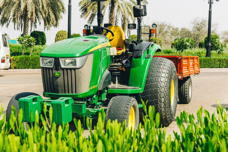 Dubai, UAE, United Arab Emirates - May 25, 2021: John Deere Compact Utility Tractor 4066M with...