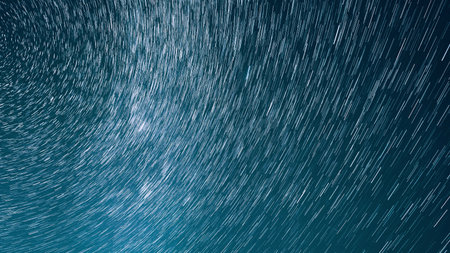 Hyper Trails Of Stars. Bewitching Illusion Of Star Trails. Star And Meteoric Trails On Night Sky Background. Spin Of Unusual Amazing Stars Effect In Sky. Rotate Of Sky Background. Large Exposure. Meteors Cross Dark Blue Sky.の写真素材