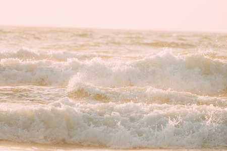 Evening sunlight sunshine above sea. Amazing landscape scenery. Sea ocean water surface with foaming small waves. Sea ocean water surface with Crashing waves. Copy space. Nature backgroundの写真素材