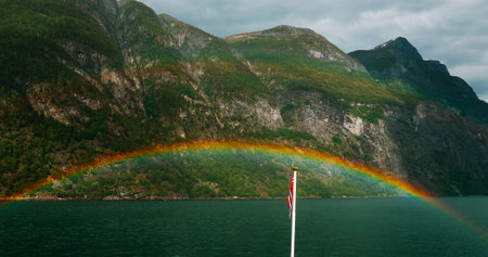 Sunnylvsfjorden, Norway. Colorful Rainbow Above Sunnylvsfjorden Spring Landscape. Panorama View From Floating Touristic Ship Ferry Boat In Summer Day. Famous Norwegian Landmark And Popular Destinationの写真素材