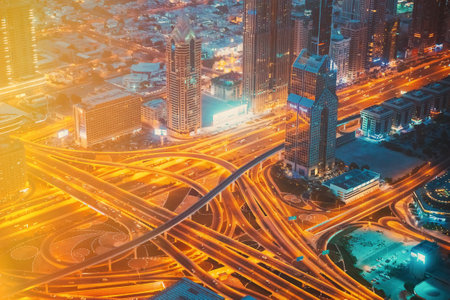 Dubai, UAE, United Arab Emirates - May 25, 2021: Aerial View Of Evening Night Traffic Of Dubai. City Street Night Yellow Illumination Of Residential District In Dubai. Night Scenic View Of Skyscraper In Dubai. High quality photoのeditorial素材