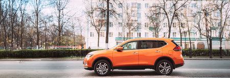 Orange Nissan X-Trail third generation Car Parked At Street. Side Viewのeditorial素材