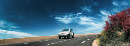 Jeep Wrangler JK drive in mountains road. third generation of the Jeep Wrangler off-road vehicle....