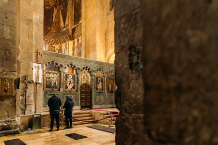 Mtskheta, Georgia - March 18, 2022: Fresco, Frescoes. People praying in Svetitskhoveli Cathedral Of The Living Pillar, Ancient Georgian Orthodox Churchのeditorial素材