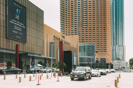 Dubai, UAE, United Arab Emirates - May 28, 2021: Cars parking near Dubai shopping mall. View of car parking near shopping center Dubai mall in summer day. Urban background. Street with row of parked cars near Dubai shopping mallのeditorial素材