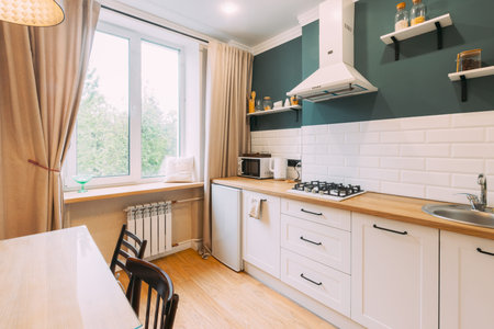 Modern Bright Kitchen In Scandinavian Stylish. Family Apartment With Dinner Table And Chairs. Idea...