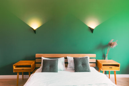 Modern Bright Bedrooms In Scandinavian Stylish. Family Apartment With Bright Green Wall And Wooden Designed Bed, Wall Lights. Idea For Home Design. Light Colors Of Design. Close-up Viewの写真素材