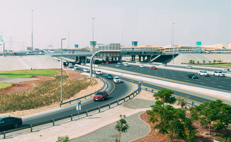 Dubai, UAE, United Arab Emirates - May 22, 2021: Traffic on street in Dubai. Cars moving at street in sunny summer day. Urban backgroundのeditorial素材