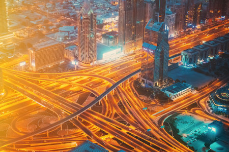 Dubai, UAE, United Arab Emirates - May 25, 2021: Aerial View Of Evening Night Traffic Of Dubai. City Street Night Yellow Illumination Of Residential District In Dubai. Night Scenic View Of Skyscraper In Dubai. High quality photoのeditorial素材