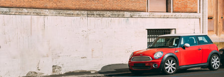 Rome, Italy. Red Mini Cooper Hatch Car Of Second Generation Parked At Streetのeditorial素材