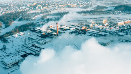 Aerial View Of Old Paper Mill Factory. Birds-eye View At Sunny Snowy Winter Day . Plant Pipe With Escaping Steam Or Smokeの写真素材