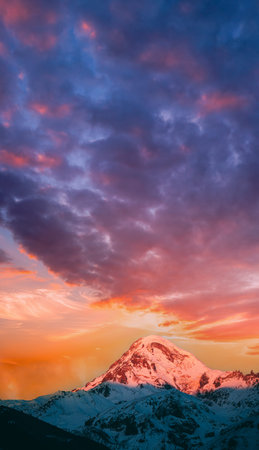 Georgia. Mount Kazbek Covered Snow In Winter Sunrise. Morning Dawn Colored Top Of Mountain In...