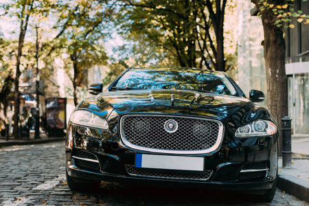 Jaguar XJ X351 parker on city street. The Jaguar XJ is a series of mid-size full-size luxury cars produced by British automobile manufacturer Jaguar Cars.のeditorial素材