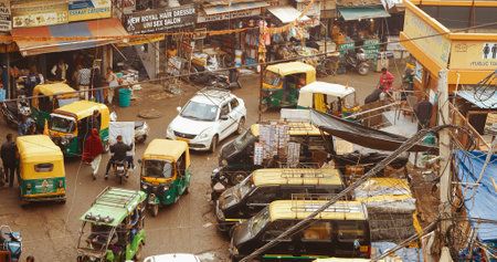 New Delhi, Delhi, India - February 04, 2024: Traffic On The Main Bazar road Street Paharganj. Cars, Motorcycles, Auto Rickshaw Or Tuk-tuk Moving On Street In morningのeditorial素材