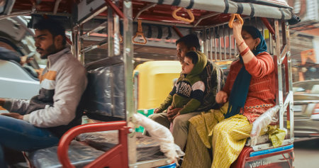New Delhi, Delhi, India - February 04, 2024: Traffic On The Main Bazar road Street Paharganj. Cars, Motorcycles, Auto Rickshaw Or Tuk-tuk Moving On Street In morning. View on hotels and shopping placesのeditorial素材