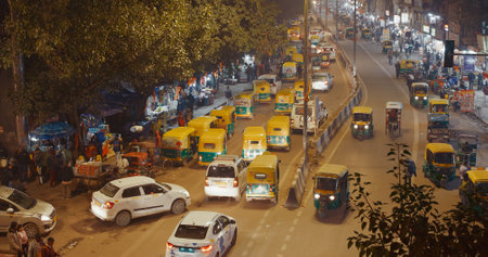 New Delhi, Delhi, India. Traffic On The Main Bazar road Street Paharganj. Cars, Motorcycles, Auto Rickshaw Or Tuk-tuk Moving On Street In night . night -のeditorial素材