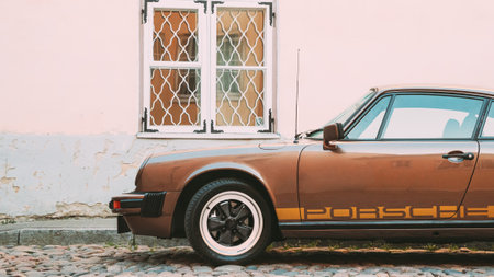 Side View Of Porsche 930 Car Parked In Old Narrow Street.のeditorial素材