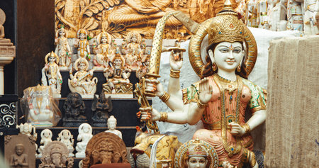 shop with marble and granite goods - statues, bas-relief decorations. India, Asia. Durga is a major Hindu goddess, worshipped as a principal aspect of the mother goddess Mahadevi. She is associated with protection, strength, motherhood, destruction, and wのeditorial素材