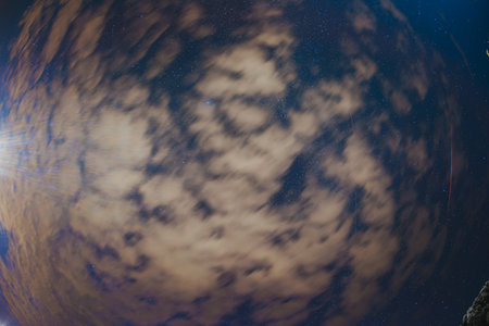 Super fisheye wide angel lens view - Cloudy Night Starry Sky With Glowing Stars. Bright Glow Of Sky Stars And Galaxy. Natural Background Backdropの写真素材