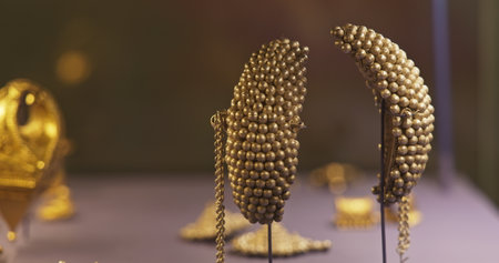 Ancient Gold Earrings or Karnabhushane - Symbol Of Lakshmi, Goddess Of Wealth. Ancient Splendor, Wealth And Elegance. Gold Represents Sky And Sun, It Is Naturally Luminous, And Is Symbol Of Lifeの写真素材