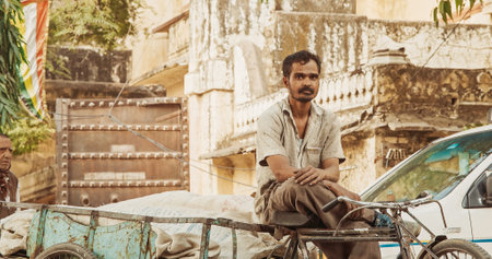 Jaipur, India. Indian Man On Cargo Bicycle Wait For Carries. Everyday Life Of India. Indian Man Look At Camera. Old Bicycle For Transporting Goods. Cargo Lorry Trishawのeditorial素材
