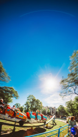 People Having Fun On Rollercoaster In Parkの写真素材