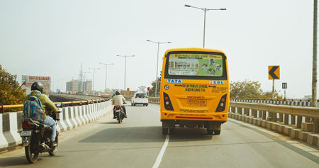 Varanasi, India. School bus in Traffic in Banaras. School bus carries a children passengers along...