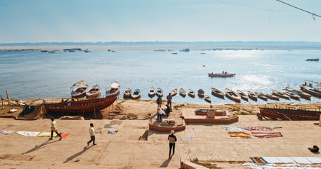 Varanasi, Uttar Pradesh, India. Sadhu - indian holyman walking on the ghat at morning. Raja Ghat Ganges river. Shivala Ghatのeditorial素材