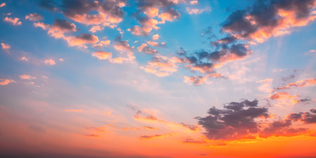 Sunset Sunrise Sky Background. Natural Bright Dramatic Sky In Sunset Dawn Sunrise. Yellow Pink Colorsの写真素材