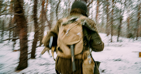 Re-enactor Dressed As American Infantry Soldier Fast Running By Forest In Cold Winter Day. Soldier Retreats From Enemy Attack. Usa Army Soldiers Of World War Ii. Will To Life. Heroes Of War. Chasingの写真素材