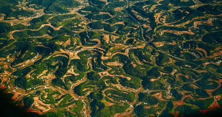 View From Airplane Window On Surroundings Of Chengdu, China. Mountainous Wooded Terrain Landscape Of China. Porthole View Or Called Bulls-eye Window. Private Buildingsの写真素材