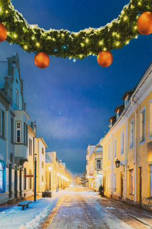 Parnu, Estonia. Night View Of Famous Ruutli Street With Old Buildings, Restaurants, Cafe, Hotels And Shops In Festive Evening Night Christmas Xmas New Year Illuminationsの写真素材