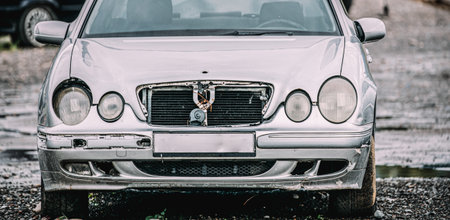 Gray Color Luxury Car With Damages After Accident In Streetの写真素材