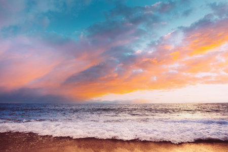 Sea Or Ocean Waves And Colorful Sunset Or Sunrise Sky Backgroundの写真素材