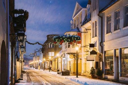 Parnu, Estonia. Night View Of Famous Ruutli Street With Old Buildings, Restaurants, Cafe, Hotels And Shops In Festive Evening Night Christmas Xmas New Year Illuminationsの写真素材