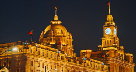 Shanghai, China. Clock tower of Shanghai, soaring beautifully at night. The Bund, Shanghai Custom House Building, The Clock Towerの写真素材