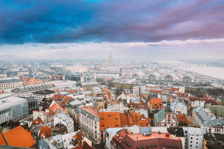 Riga, Latvia. Top View Cityscape In Misty Fog Rainy Day. Latvian Academy Of Sciences, Bus Station Riga International Coach Terminal And Riga Central Marketの写真素材
