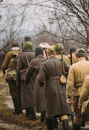 World War II Russian Soviet Red Army Soldiers Marching Through Forest. Soldier Of WWII WW2 Timesの写真素材