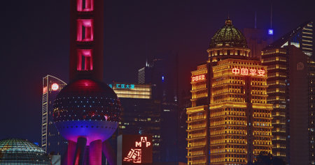 Vibrant Night Scene of Shanghai with Iconic Towers and Modern Architecture