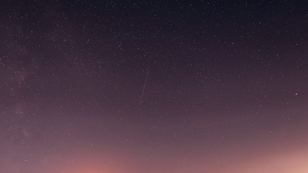 Night sky stars with shooting star and pink gradient