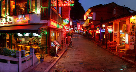 YANGSHUO TOWN , GUANGXI, CHINA - MARCH 30: Attractions in South China, popular with tourists from all over world. March 30, 2010. Yangshuo West Street at night attracts tourists dining and nightlife.のeditorial素材