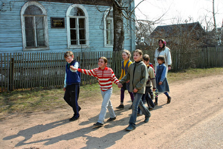 Tver, Russia - May 2, 2006: Elementary school in the Russian countryside, junior schoolchildren walk outdoors. An ungraded elementary rural school, four classes to the total number pupils, seven people.のeditorial素材