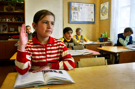 Tver, Russia - May 2, 2006: Schegoleva Tanya, 11 years old, Rural school, school class, schoolgirl raises his hand.のeditorial素材