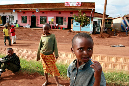 Makuyuni, Arusha, Tanzania - February 13, 2008: Dark-skinned African street children play in the village street.のeditorial素材