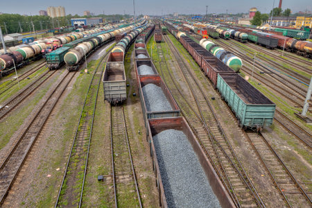 St. Petersburg, Russia - May 22, 2015: Classification yard, many railway track lines, railroad freight yard, goods train with bulk cargo, logistics park.のeditorial素材