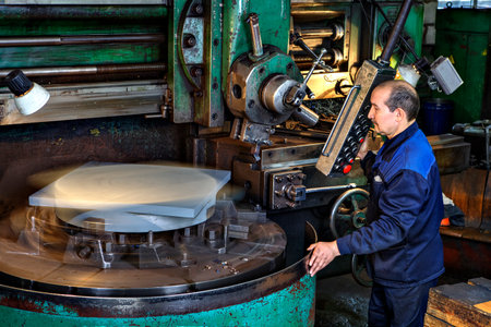 St. Petersburg, Russia - May 21, 2015: Work watching the process metal working on a vertical turning machines.のeditorial素材