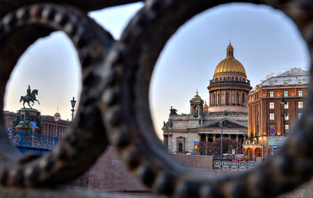 St. Petersburg, Russia - December 27, 2015: View on St. Isaac's Square and St. Isaac's Cathedral in Saint Petersburg, through the iron fence Moika Embankment.のeditorial素材