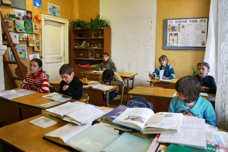 Podol village, Tver region, Russia - May 5, 2006: Students are sitting at their desks in a classroom during a lesson, elementary rural school.のeditorial素材