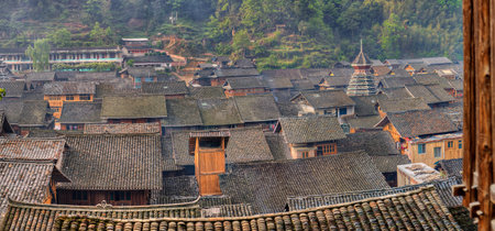 Zhaoxing Dong Village, Guizhou Province, China -  April 9, 2010:  Tile roofs farmhouses in the mountain village of ethnic minorities in southwest China.のeditorial素材